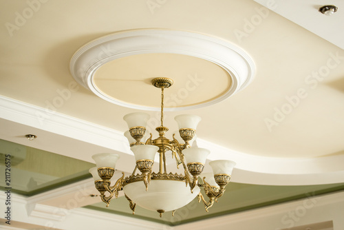 Vintage luxury chandelier in antique style in elegant interior closeup