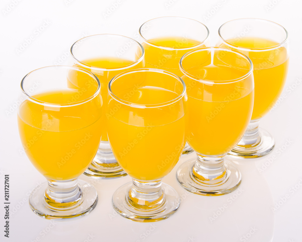 Fruit drink in glasses on white