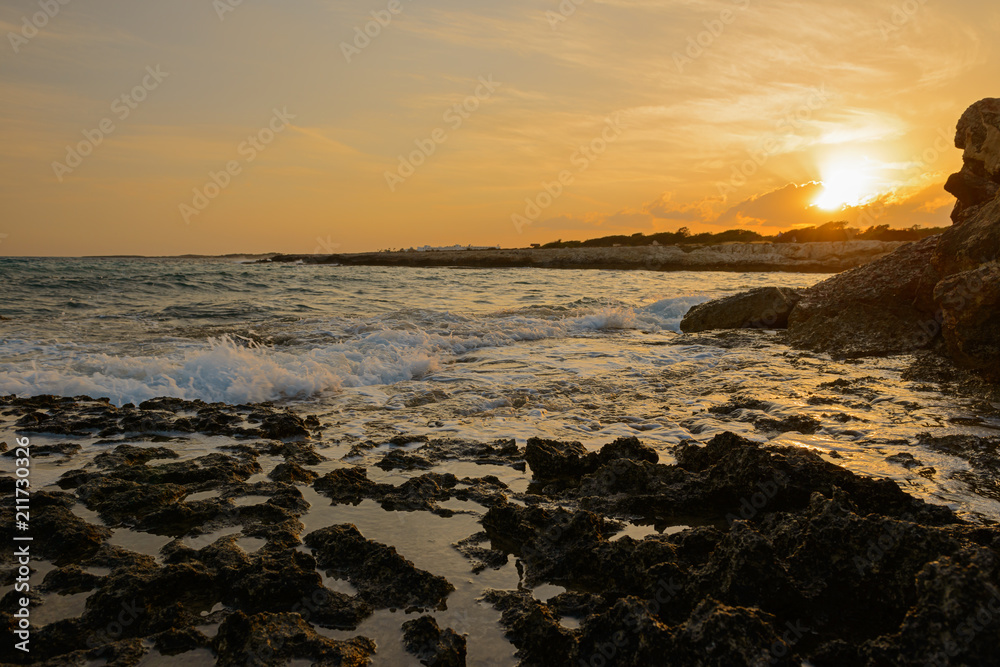 landscape with sunset over a rocky seashore