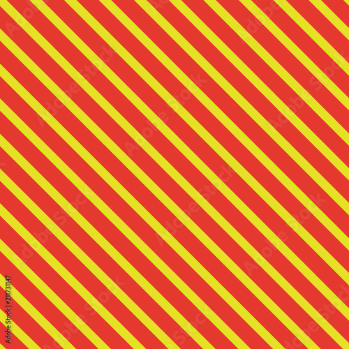 Pattern with vertical lines. Seamless background. Bright orange and yellow. For printing on fabric, paper, wrapper.
