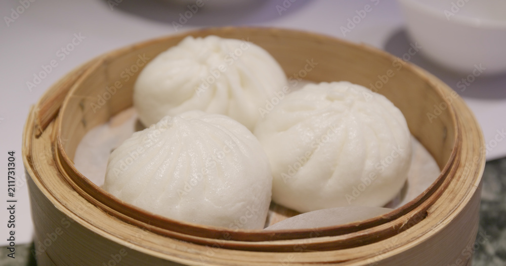 Steamed chinese bun in bamboo basket