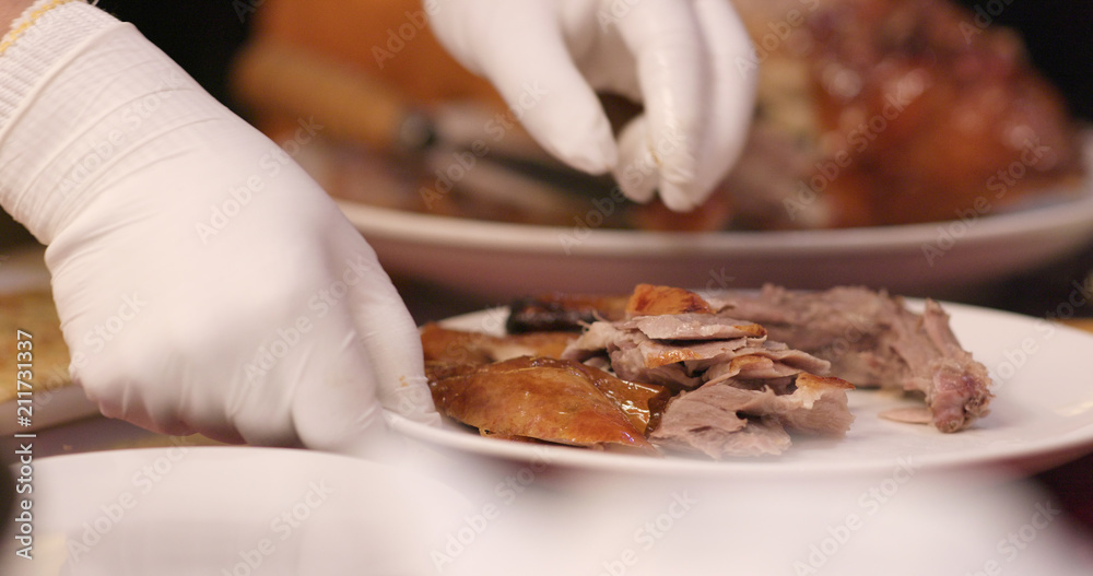 Chef cutting of grilled duck in Taiwanese restaurant