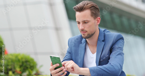Photography Businessman work on smart phone in city