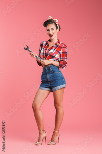 Pin-up woman isolated over pink background © Drobot Dean