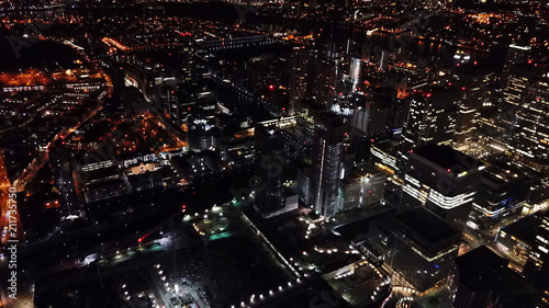 Aerial bird's eye view photo taken by drone of famous Canary Wharf skyscraper complex, Isle of Dogs, London, United Kingdom