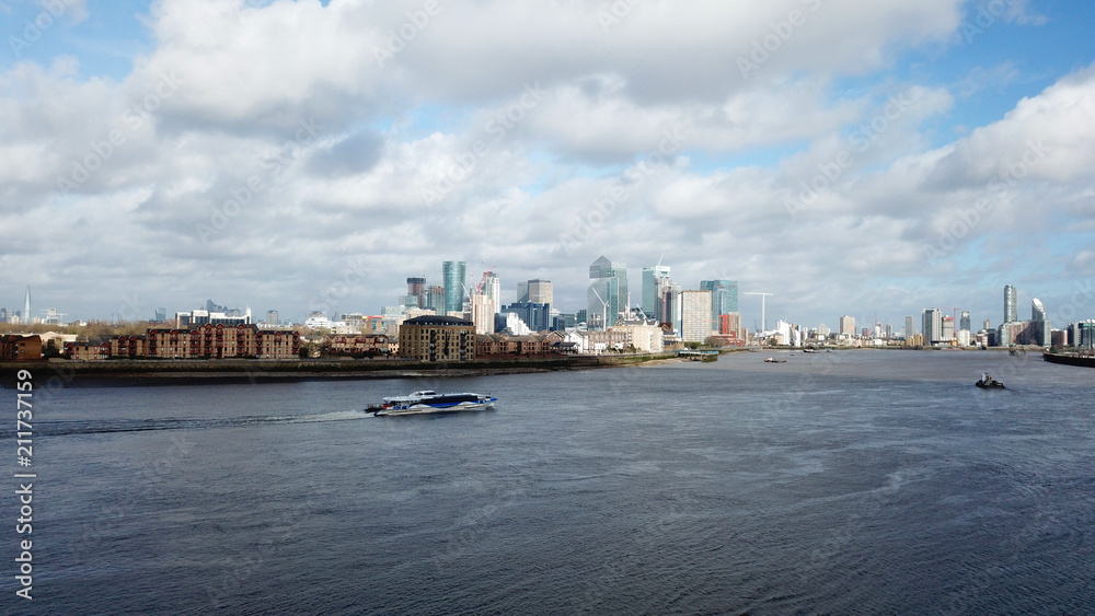 Naklejka premium Aerial bird's eye view photo taken by drone of famous Docklands and Canary Wharf skyscraper complex, Isle of Dogs, London, United Kingdom