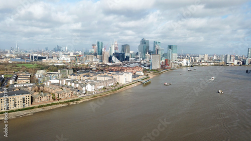 Aerial bird's eye view photo taken by drone of famous Docklands and Canary Wharf skyscraper complex, Isle of Dogs, London, United Kingdom