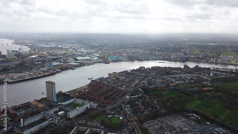 Aerial bird's eye view photo taken by drone of famous Docklands and Canary Wharf skyscraper complex, Isle of Dogs, London, United Kingdom