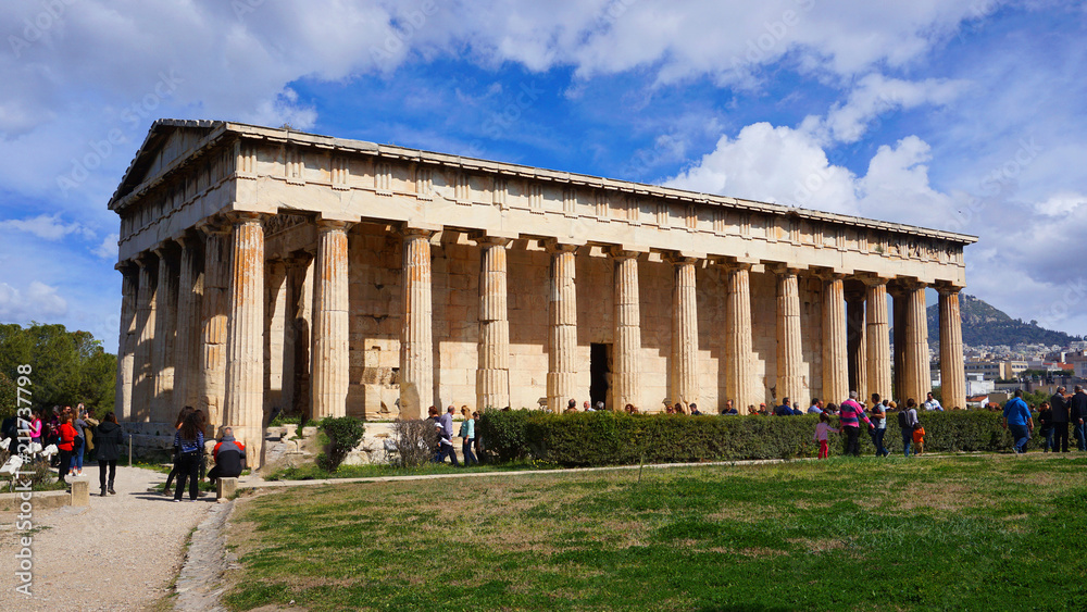 Beautiful blue clouds and iconic Temple of Hephaestus one of the best preserved temples in Greece, Ancient Agora, Athens historic center, Attica, Greece