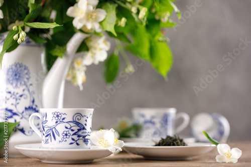 A magnificent forfor tea set with a fragrant green tea. Green tea with a taste of jasmine. photo