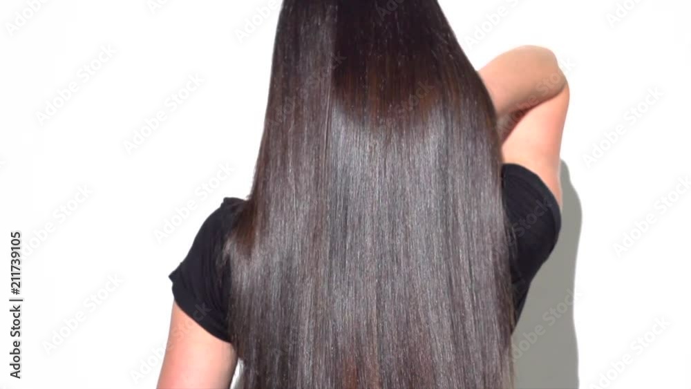 Beautiful strait long black hair. Beauty sexy brunette girl with healthy long hair. Slow motion 240 fps. 4K UHD video 3840x2160