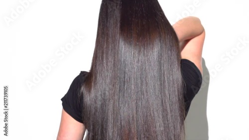 Beautiful strait long black hair. Beauty sexy brunette girl with healthy long hair. Slow motion 240 fps. 4K UHD video 3840x2160
