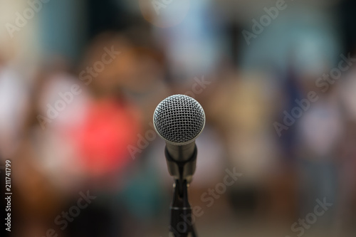 Microphone at blurred people background