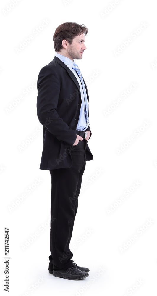 in full growth. side view.portrait of a serious business person. in full growth. side view.portrait of a serious business person.