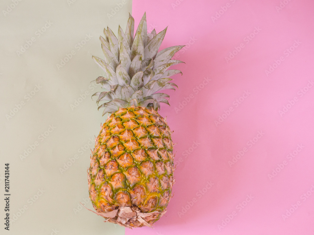 Pineapple on pink and green background with copy space Pineapple on pink and green background with copy space