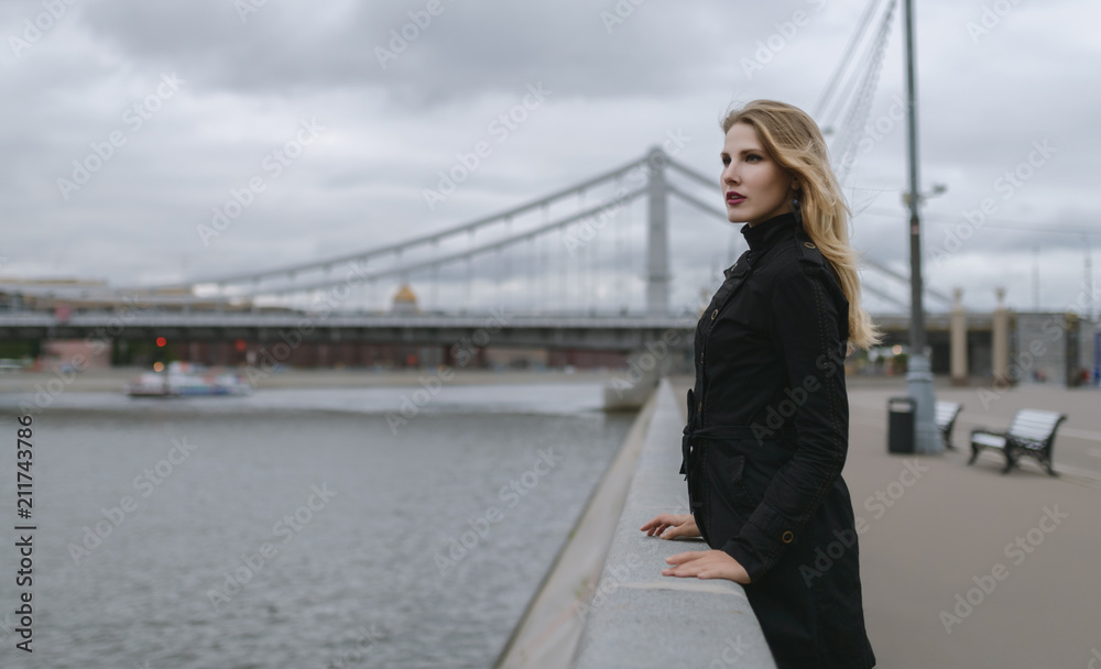 Outdoors portrait of beautiful young woman. Selective focus.