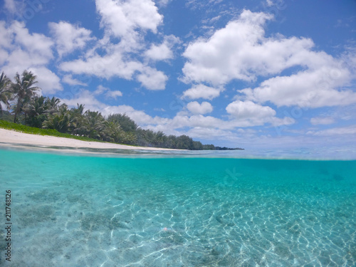 HALF UNDERWATER Amazing glassy water splashes over camera filming tropical coast