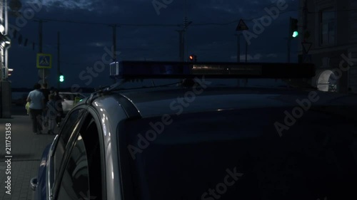 Light on the roof of a police car at night