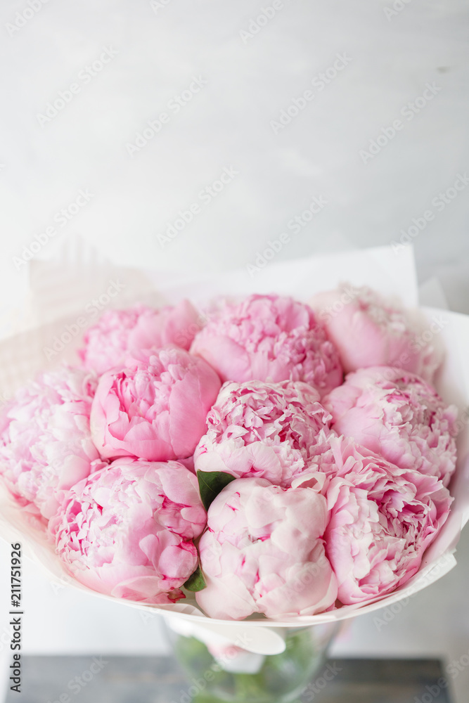 Lovely flowers in glass vase. Beautiful bouquet of pink peonies . Floral composition. Wallpaper Lovely flowers in glass vase. Beautiful bouquet of pink peonies . Floral composition. Wallpaper