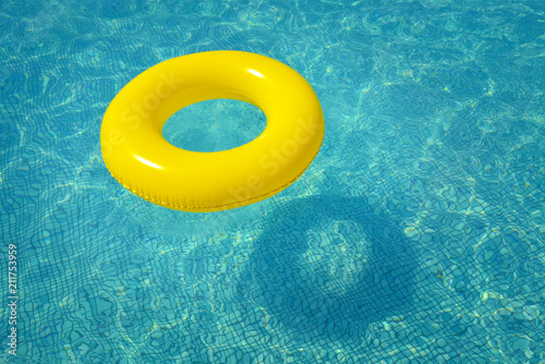 Colorful inflatable tube floating in swimming pool