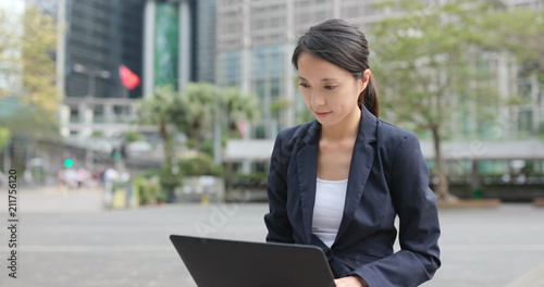Photography Young Businesswoman use of notebook computer in Hong Kong city
