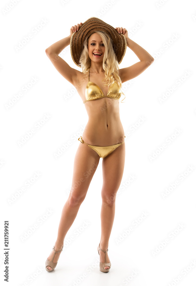 Beautiful slim girl in gold bikini foto de Stock | Adobe Stock