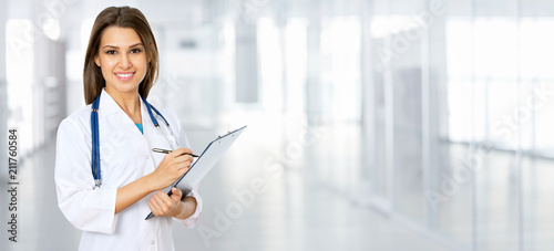 Young female doctor on modern clinic background.
