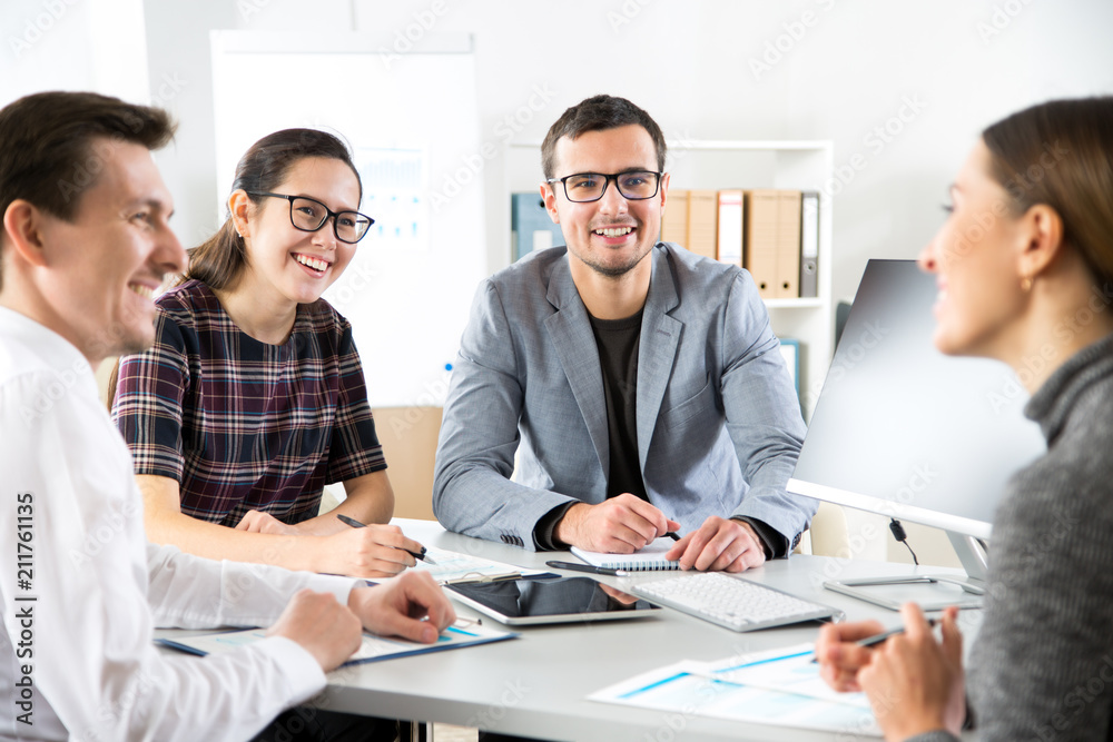 Business people are sitting around the table at a meeting in the office Business people are sitting around the table at a meeting in the office
