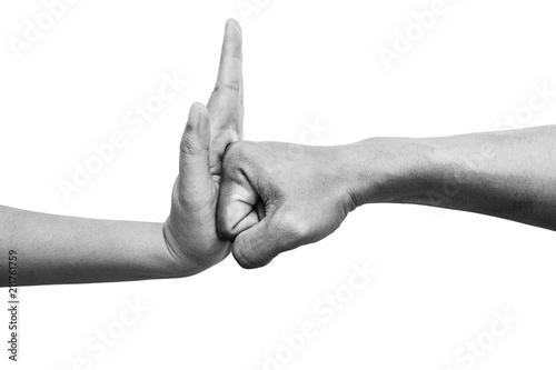 woman using hand palm to stop man's punch from attack isolated on white background. stop violence against women campaign concept with copy space, black and white color