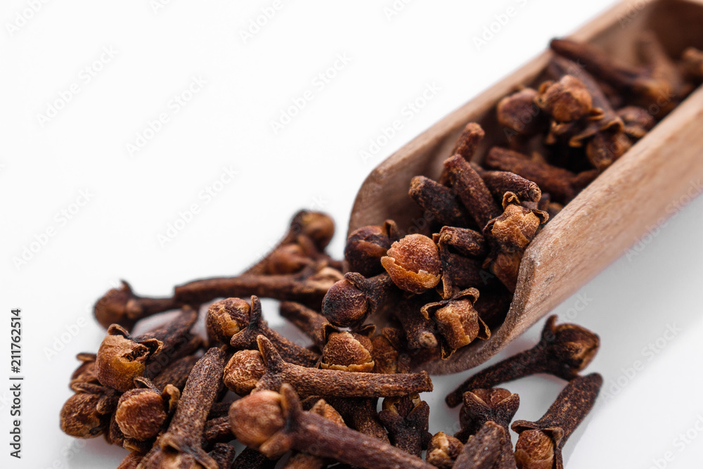 fragrant cloves on a white acrylic background fragrant cloves on a white acrylic background