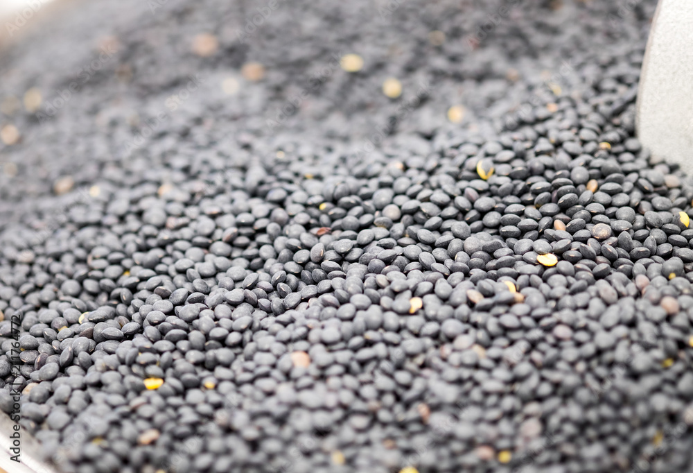 Macroshot of Black lentils, sale on local city market Macroshot of Black lentils, sale on local city market