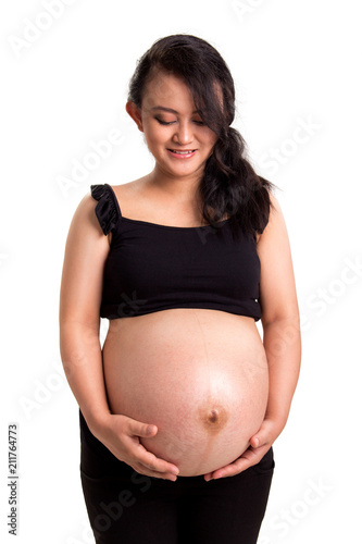 Pregnant mom caress her tummy