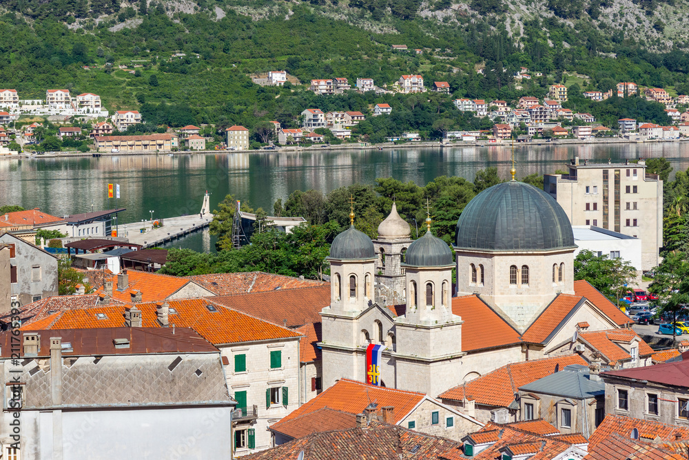 View on the old historical city Kotor with orange tile roofs, famous church at the morning, Adriatic sea coastline, Montenegro