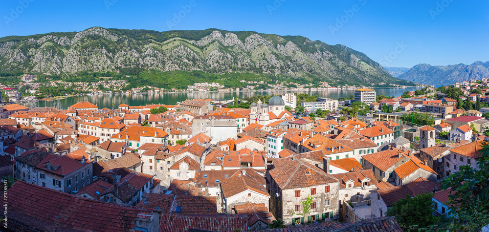 Panoramic view from above on the old historical city Kotor with orange tile roofs, boka-kotor bay and mountains at Adriatic sea coastline, Montenegro