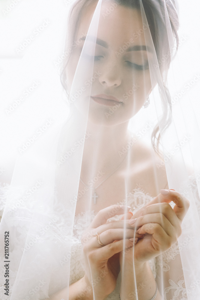 Mysterious portrait of a bride hidden under the veil