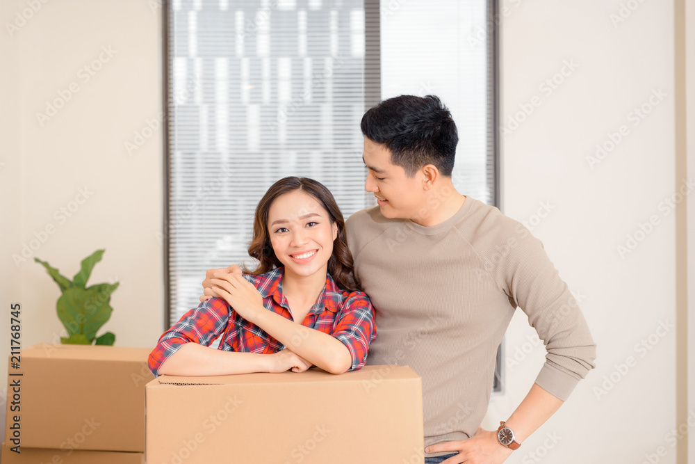 Young couple resting from moving into a new home Young couple resting from moving into a new home
