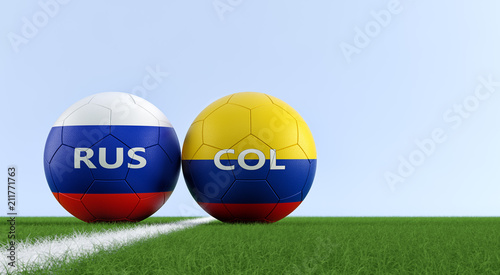 Colombia vs. Russia Soccer Match - Soccer balls in Colombia and Russia national colors on a soccer field. Copy space on the right side - 3D Rendering 