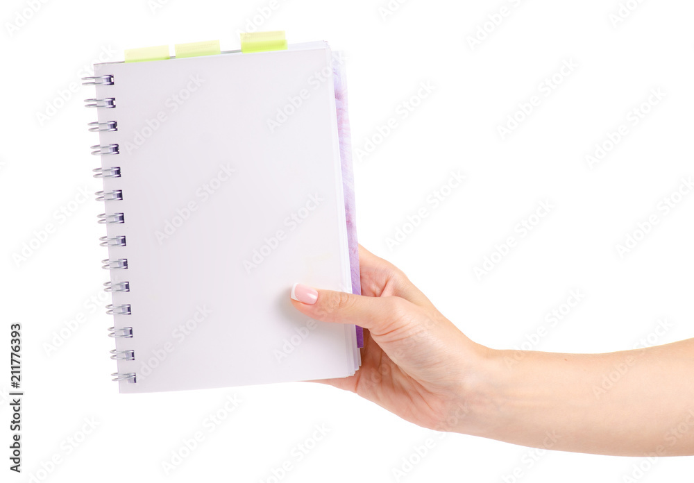 Notepad in hand on white background isolation Notepad in hand on white background isolation