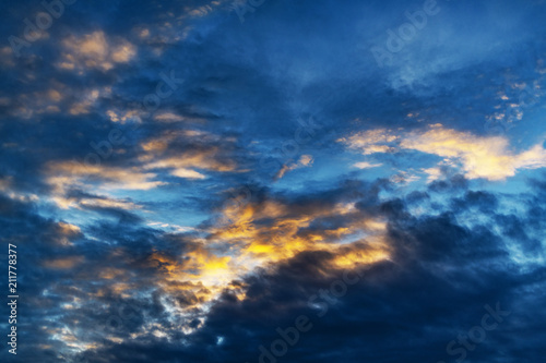 Colorful dramatic sky with clouds, at sunrise or sunset. Cloudscape for abstract background. 