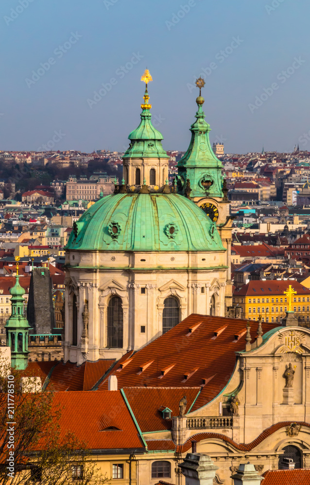 Obraz premium Cityscape with St Nicholas Church in Lesser Town in Prague, Czech Republic
