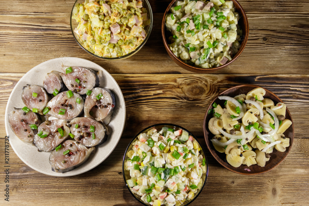 Various festive dishes on wooden table
