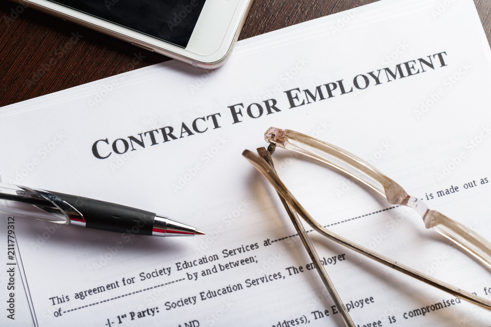 Close up shot of Eyeglasses on contract document papers business concept Close up shot of Eyeglasses on contract document papers business concept