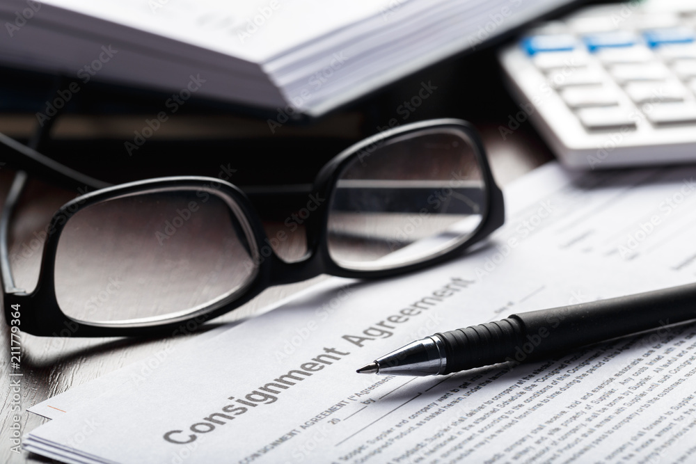 Close up shot of Eyeglasses on contract document papers business concept Close up shot of Eyeglasses on contract document papers business concept
