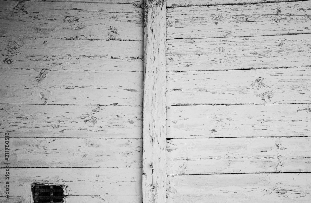 Peeling white paint pattern on old wooden background. Whitewash texture of the vintage house in the village. Peeling white paint pattern on old wooden background. Whitewash texture of the vintage house in the village.