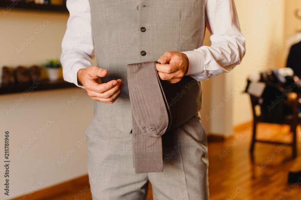 Man dressing in a suit Man dressing in a suit