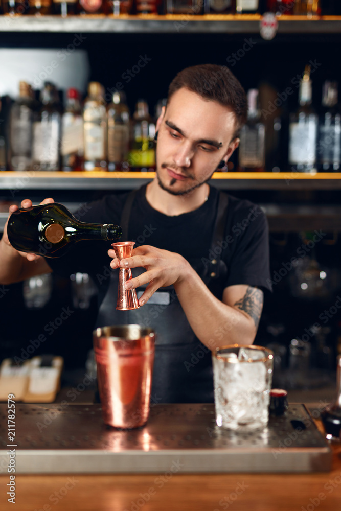 Bar. Bartender Making Cocktails, Measuring Alcohol