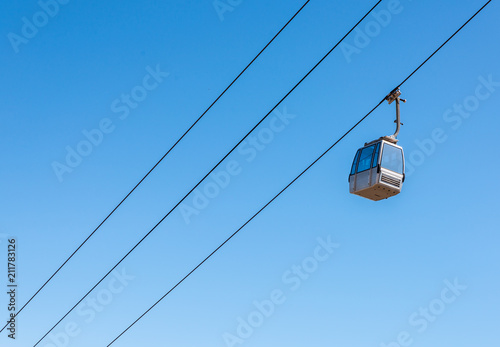 cableway against the sky, transport at height and tourist attraction