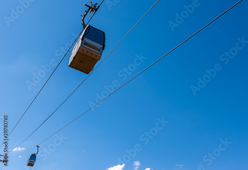 cableway against the sky, transport at height and tourist attraction