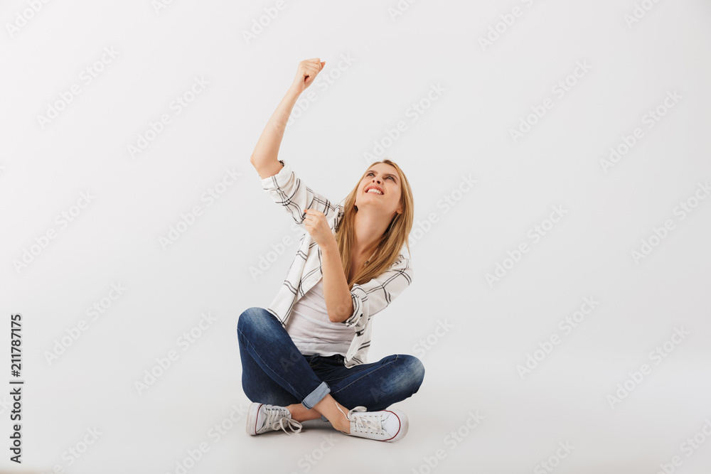 Portrait of angry young casual girl pointing up Portrait of angry young casual girl pointing up