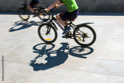 Defocused cyclist silhouette © VladFotoMag